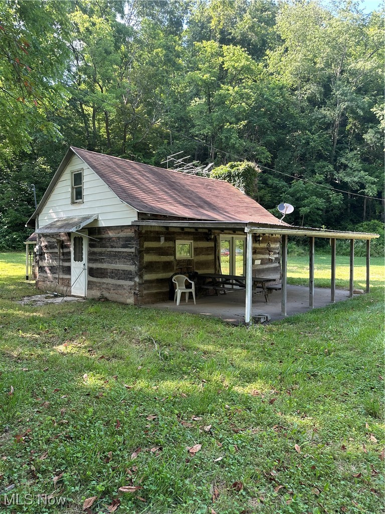 37114 Barber Ridge Road Woodsfield, OH 43793 - Photo 29 of 50 Side and Front view of the log cabin with Front porch
