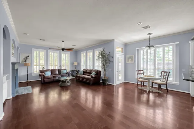 a living room with furniture fireplace and flat screen tv