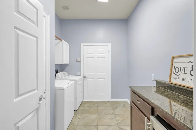 a view of a backyard with plants and outdoor seating