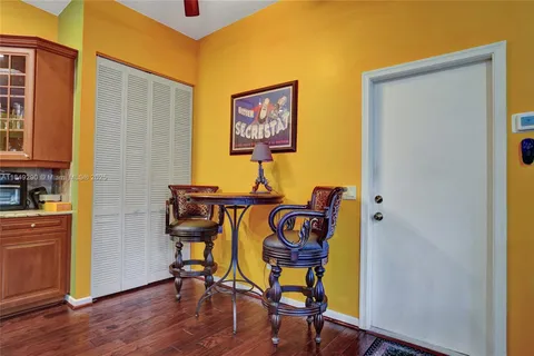 a workspace room with furniture and wooden floor