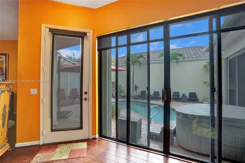 a view of a glass door and a window