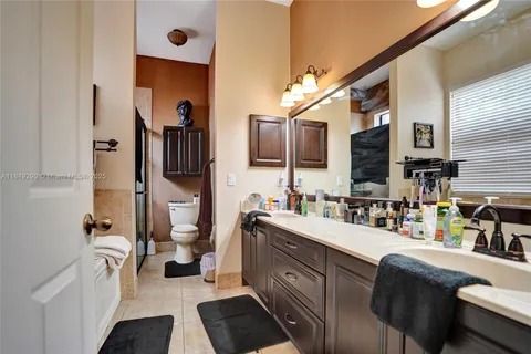 a kitchen with stainless steel appliances a sink and a refrigerator