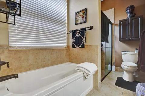 a bathroom with a bathtub and a toilet