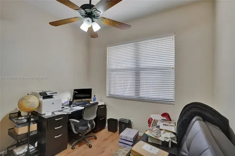 a workspace with furniture and window