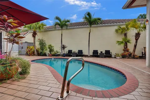 a view of a swimming pool with a patio