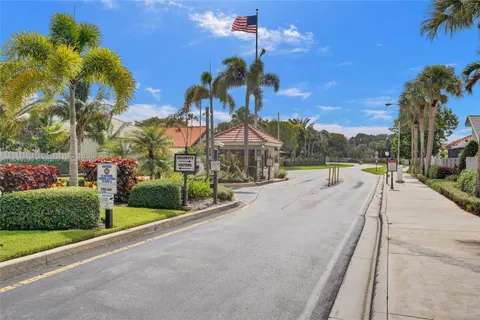 a view of a park with palm trees