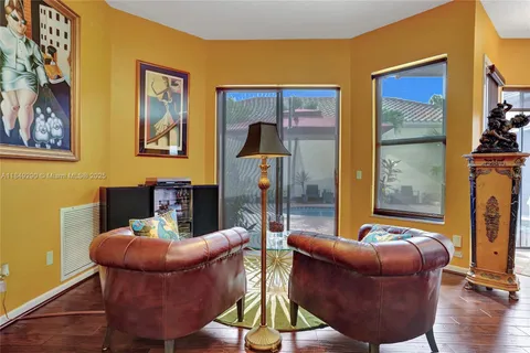 a work room with furniture and wooden floor