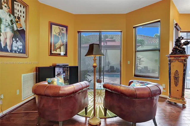 a work room with furniture and wooden floor