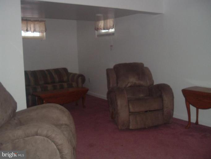 5553 Gayland Road Halethorpe, MD 21227 - Photo 7 of 12 a living room with furniture and a chair