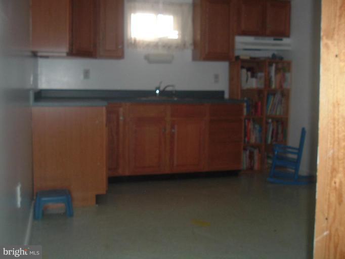 5553 Gayland Road Halethorpe, MD 21227 - Photo 8 of 12 a kitchen with a sink