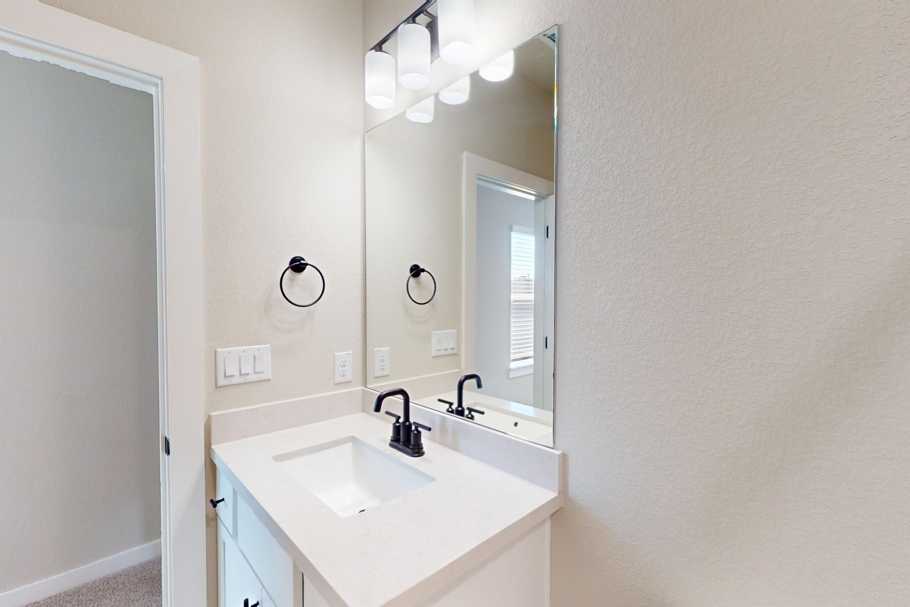 3679 Prosper Road Leander, TX 78641 - Photo 29 of 40 a bathroom with a sink and a mirror