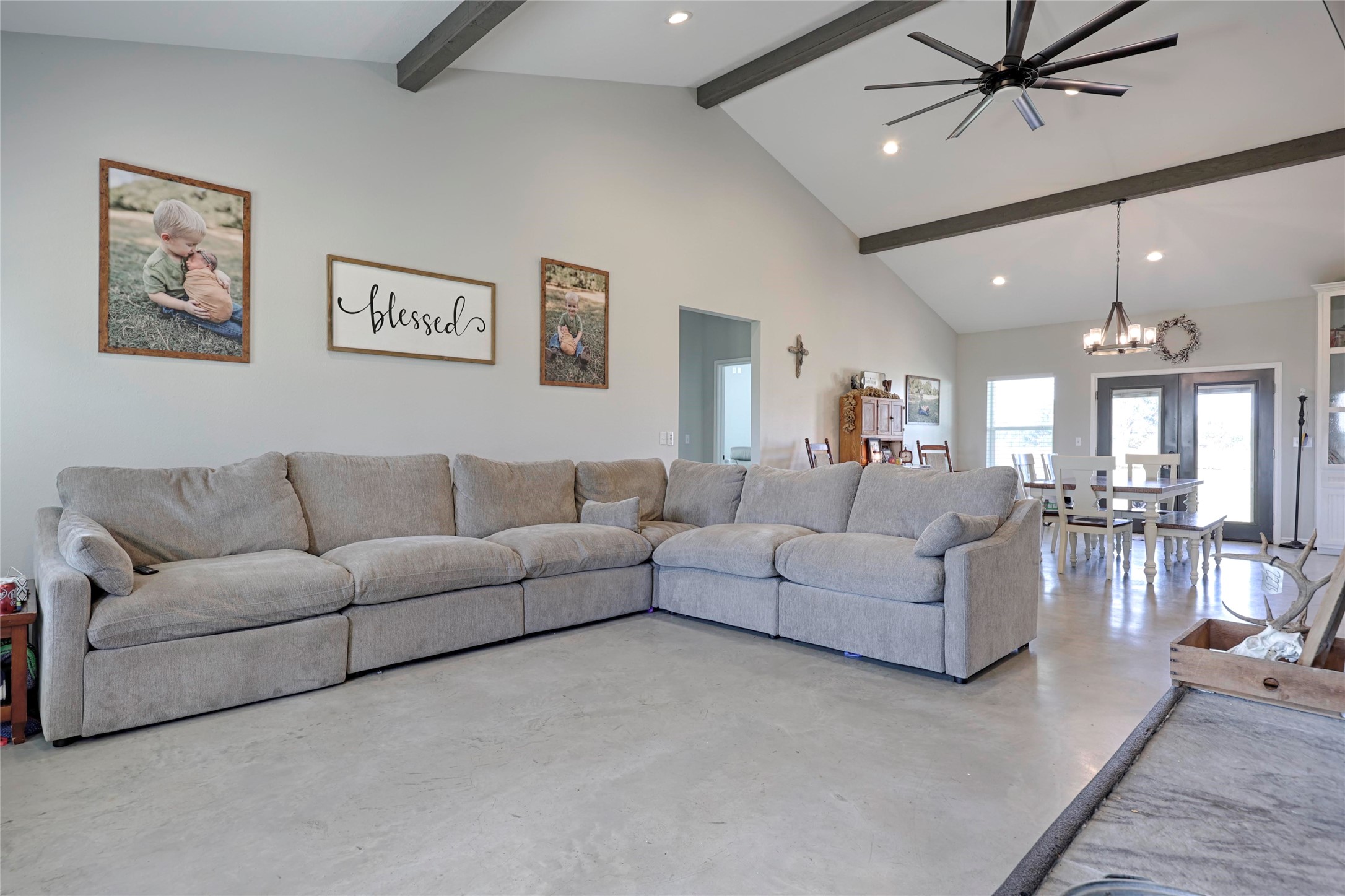 1100 Calhoun Road Eagle Lake, TX 77434 - Photo 12 of 48 a living room with furniture and a chandelier