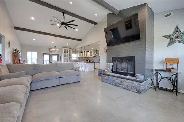 a view of a dining area with furniture and a kitchen
