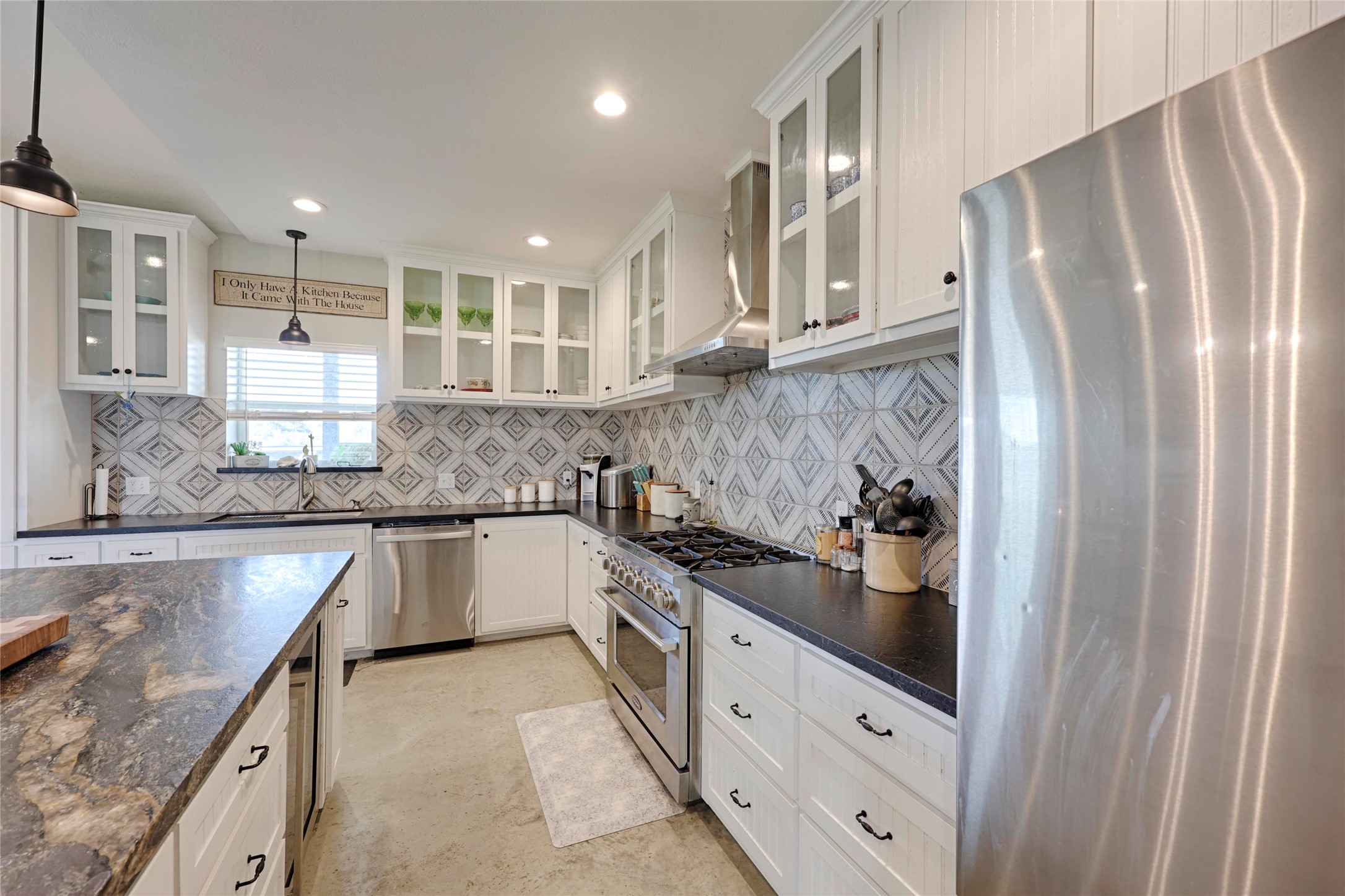 1100 Calhoun Road Eagle Lake, TX 77434 - Photo 20 of 48 a kitchen with stainless steel appliances granite countertop a refrigerator and a sink