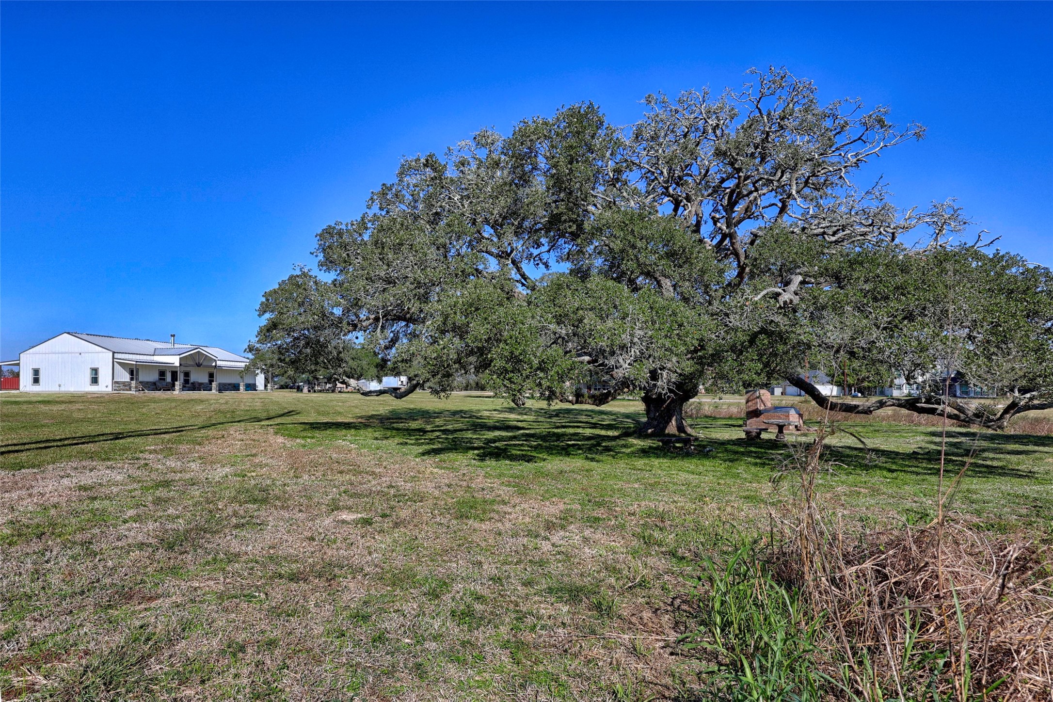 1100 Calhoun Road Eagle Lake, TX 77434 - Photo 2 of 48 a view of a field with trees