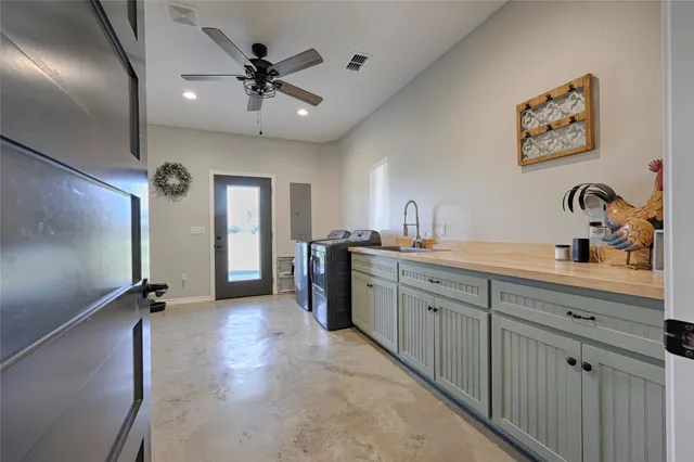 a bed room with a bed and a ceiling fan