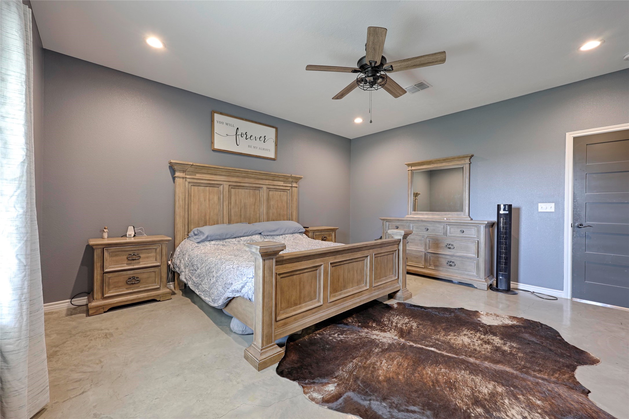1100 Calhoun Road Eagle Lake, TX 77434 - Photo 25 of 48 a bed room with a bed and a ceiling fan