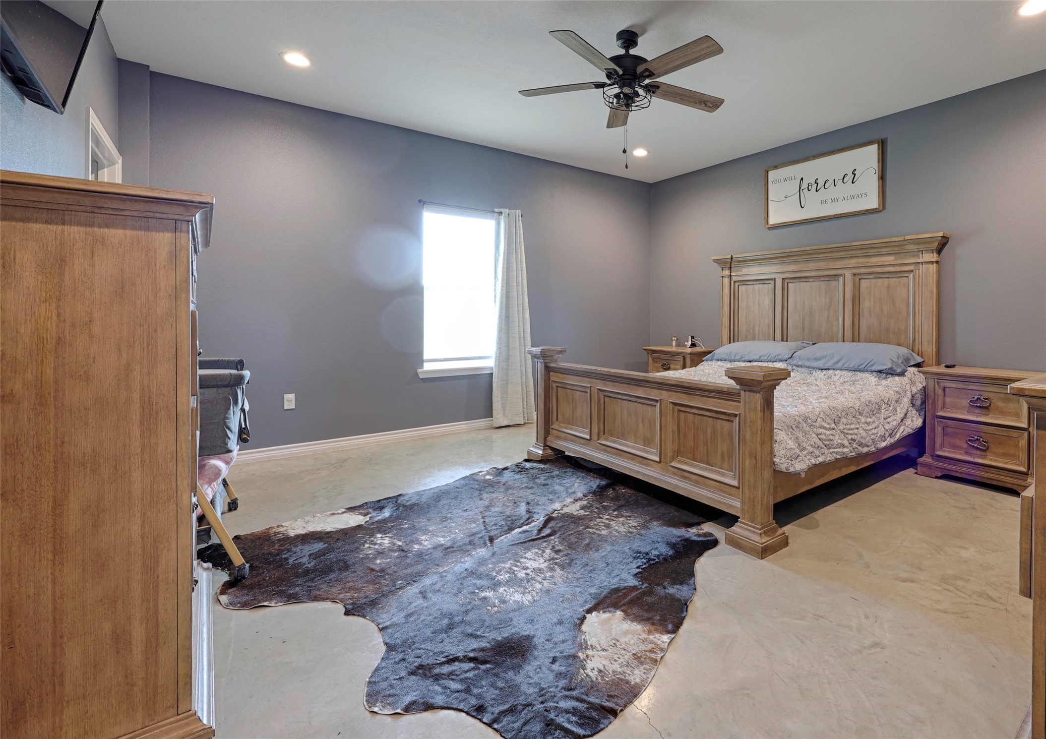 1100 Calhoun Road Eagle Lake, TX 77434 - Photo 26 of 48 a spacious bedroom with a bed and a chandelier