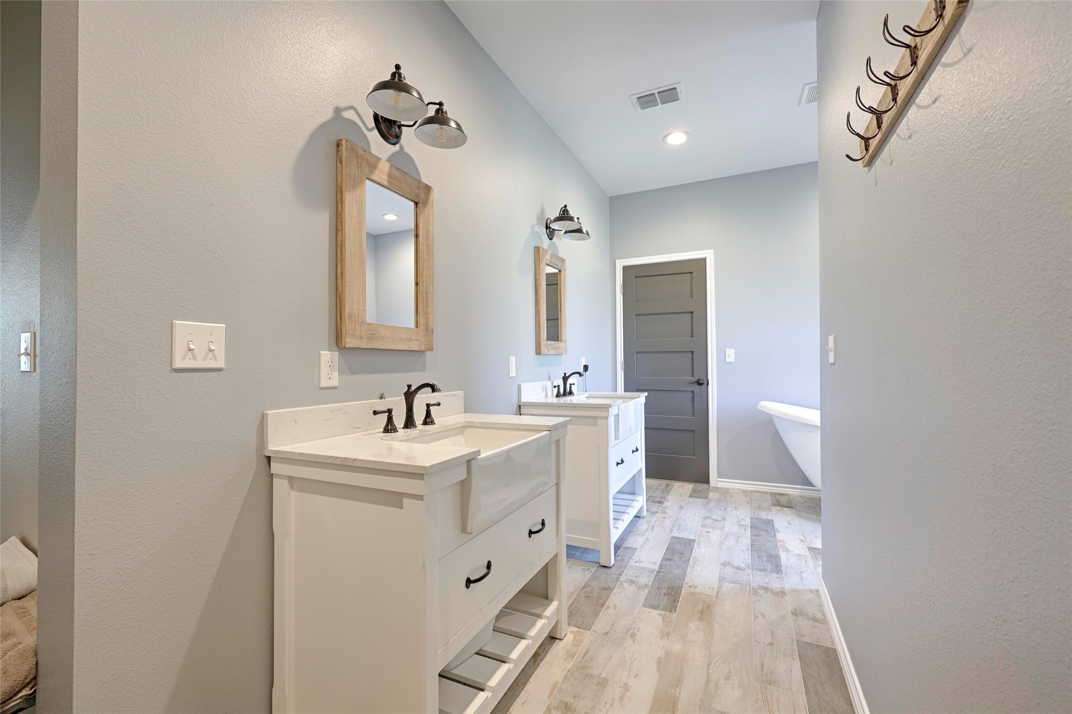 1100 Calhoun Road Eagle Lake, TX 77434 - Photo 28 of 48 a bathroom with a sink a toilet and mirror