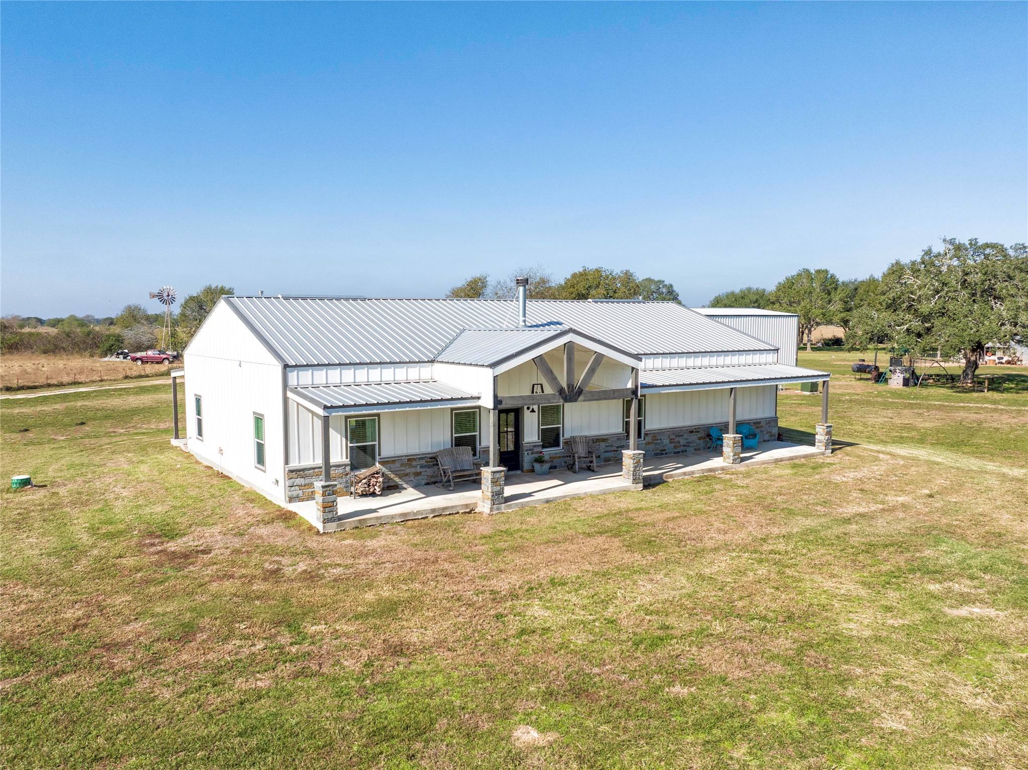 1100 Calhoun Road Eagle Lake, TX 77434 - Photo 3 of 48 a view of a white house with a big yard and large trees