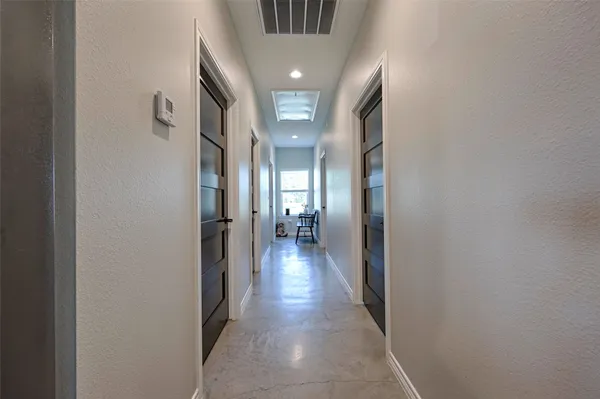 a bathroom with a bathtub shower sink mirror vanity and toilet