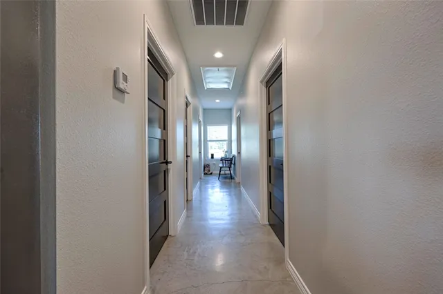 a bathroom with a bathtub shower sink mirror vanity and toilet
