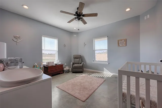 a bedroom with furniture and a window