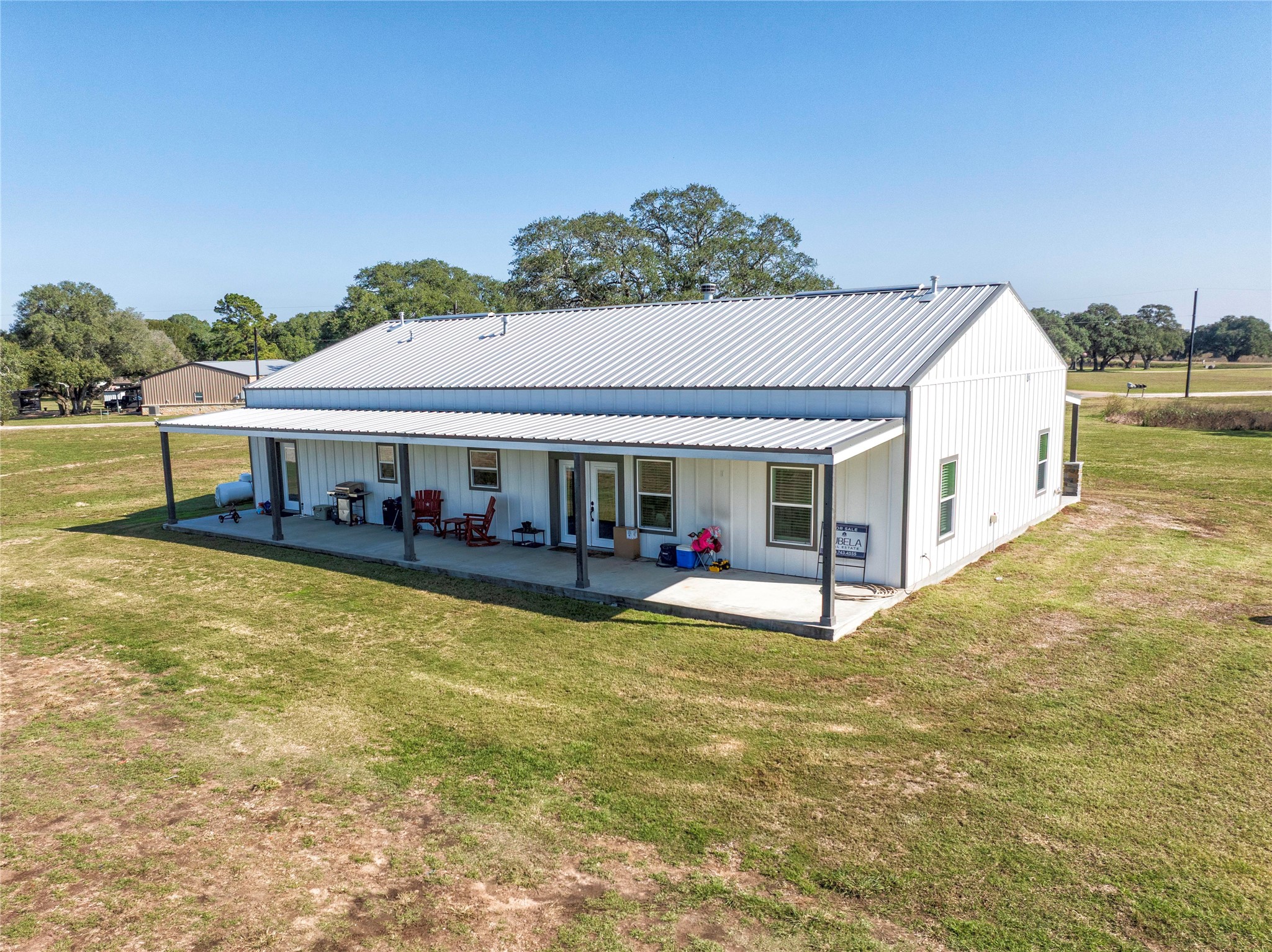 1100 Calhoun Road Eagle Lake, TX 77434 - Photo 40 of 48 a view of a house with pool and a yard