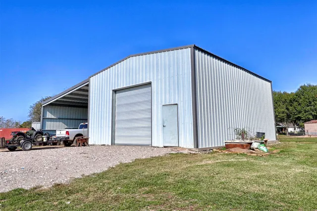 a view of a garage with parked cars