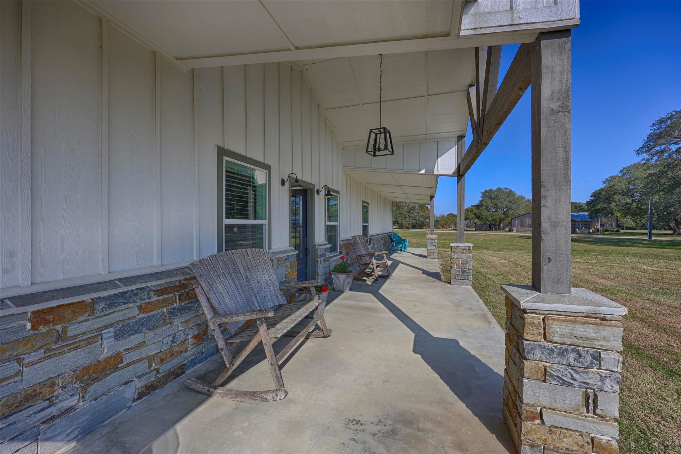 1100 Calhoun Road Eagle Lake, TX 77434 - Photo 5 of 48 a living room with patio furniture and a wooden floor