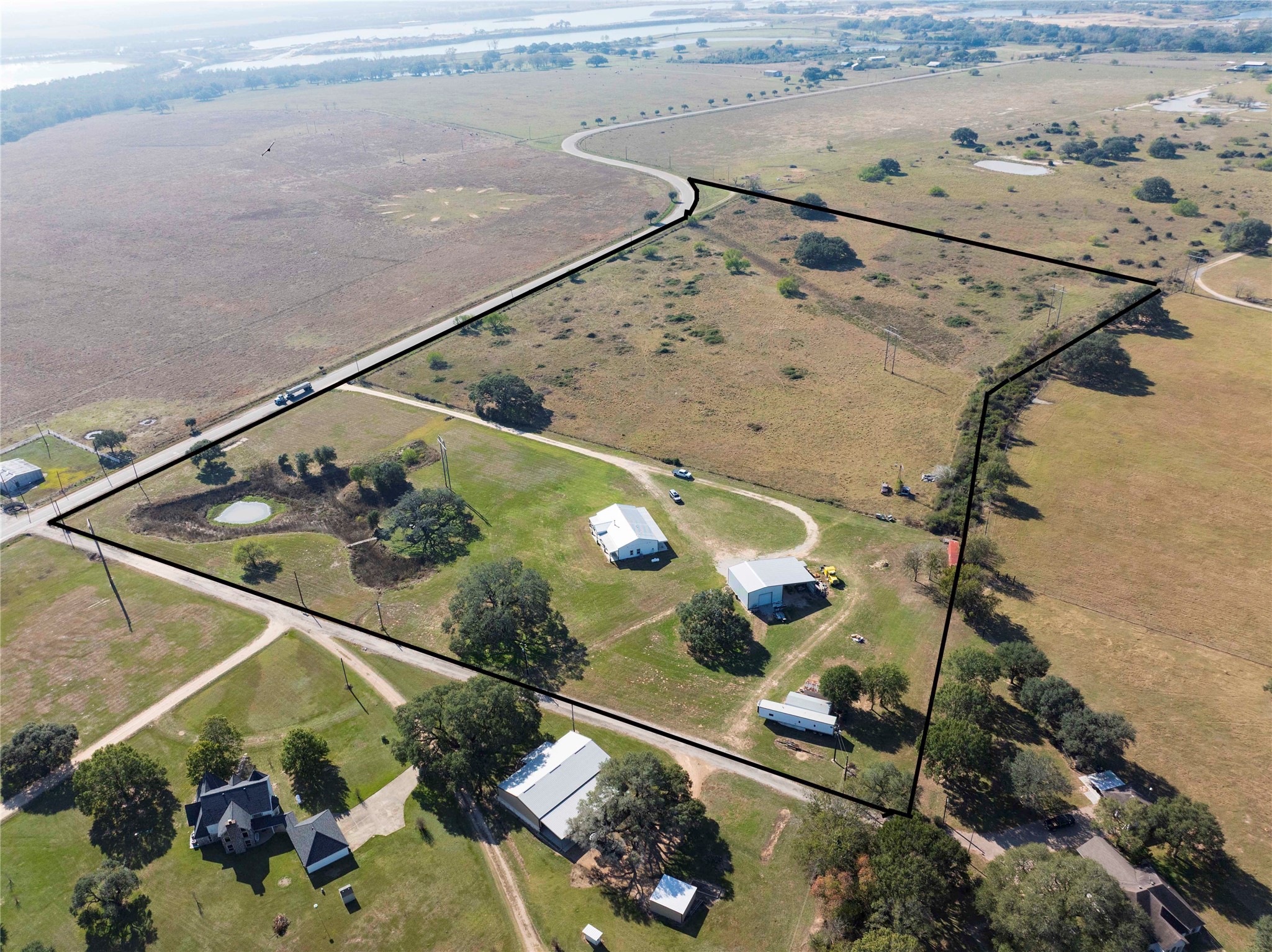 1100 Calhoun Road Eagle Lake, TX 77434 - Photo 7 of 48 an aerial view of a house a swimming pool and outdoor space