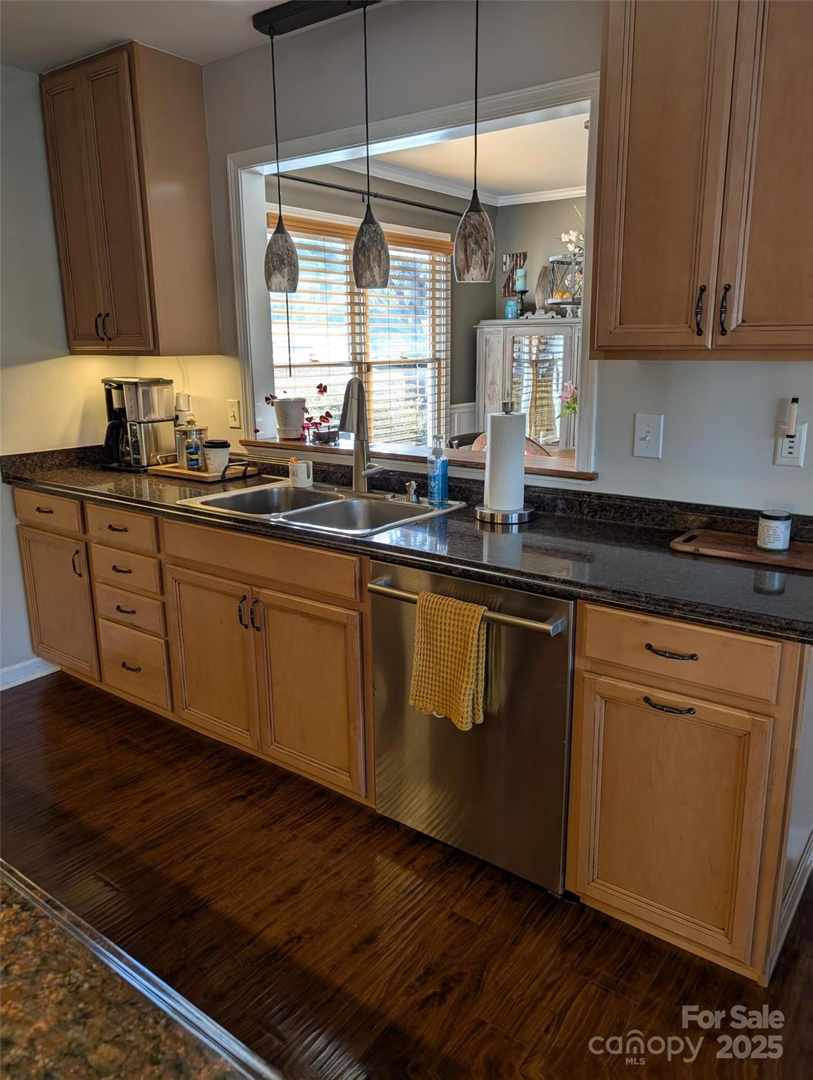 816 Maize Street Lexington, SC 29072 - Photo 18 of 34 a kitchen with granite countertop stainless steel appliances a sink window and cabinets