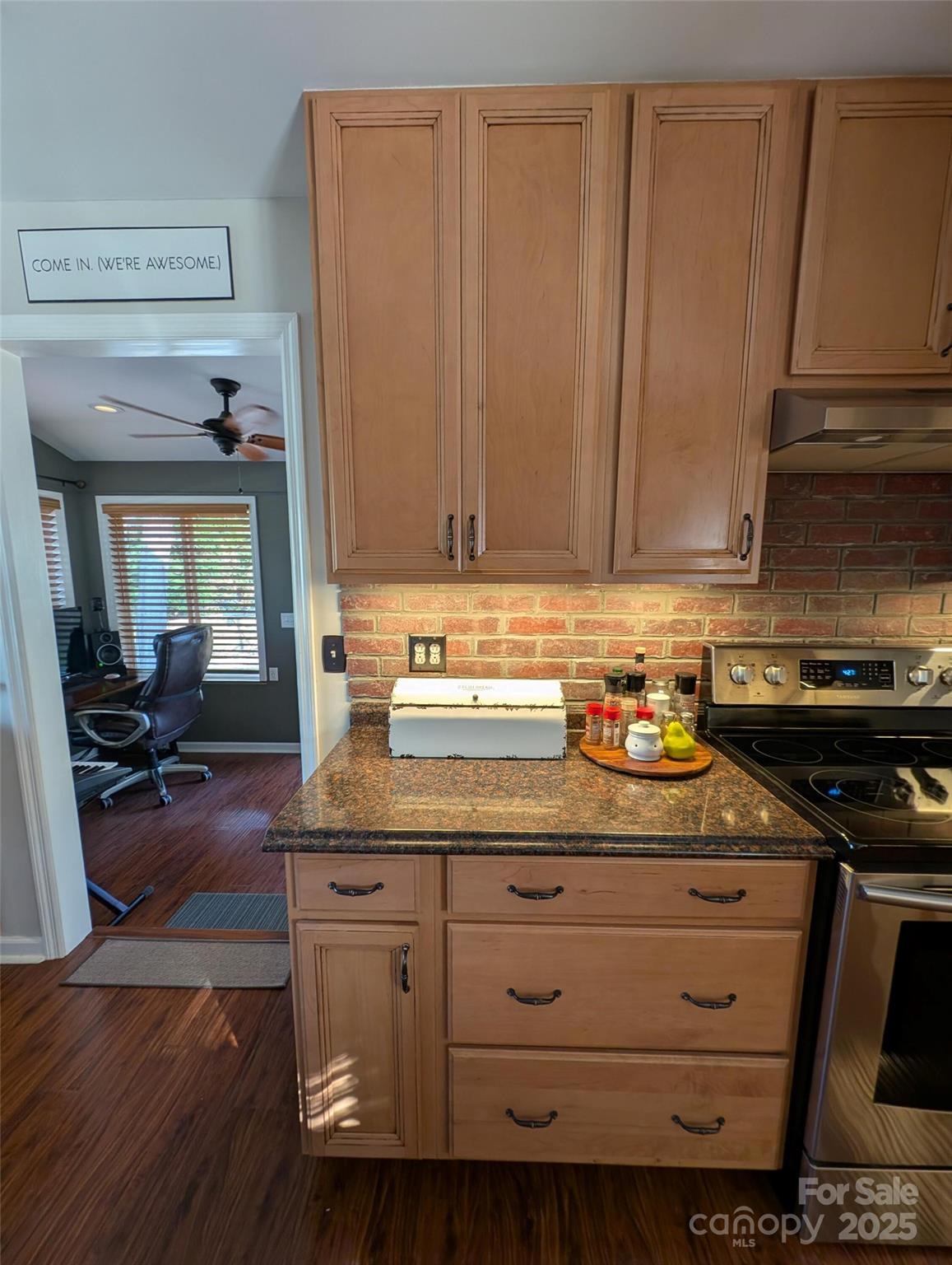 816 Maize Street Lexington, SC 29072 - Photo 19 of 34 a kitchen with cabinets appliances and a wooden floor