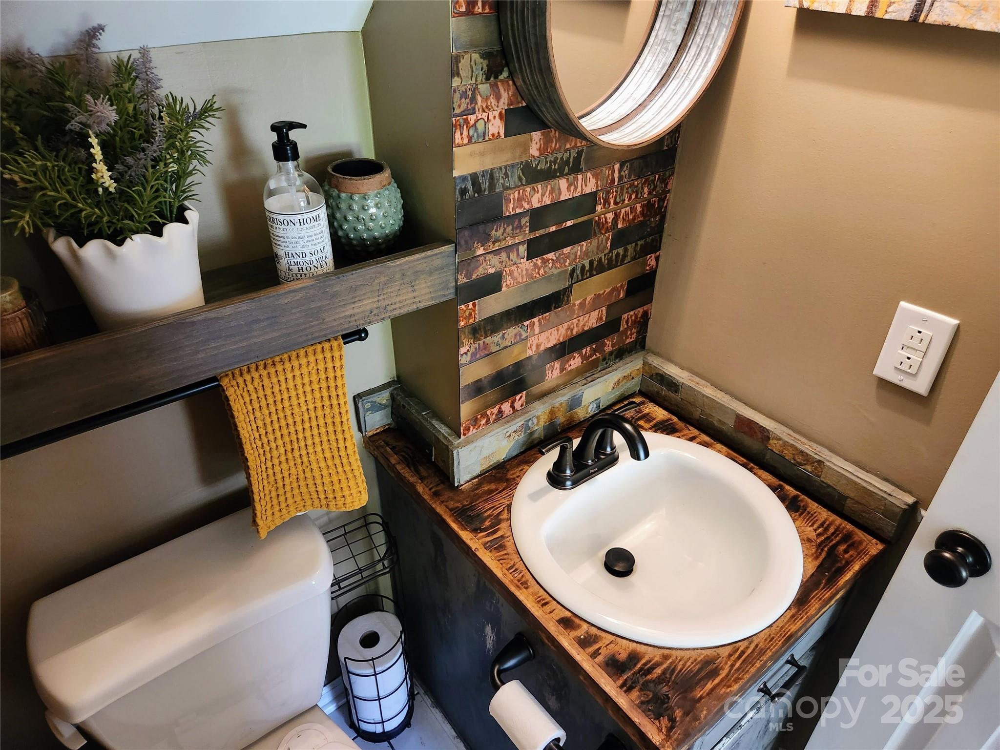 816 Maize Street Lexington, SC 29072 - Photo 22 of 34 a bathroom with a toilet a sink and mirror