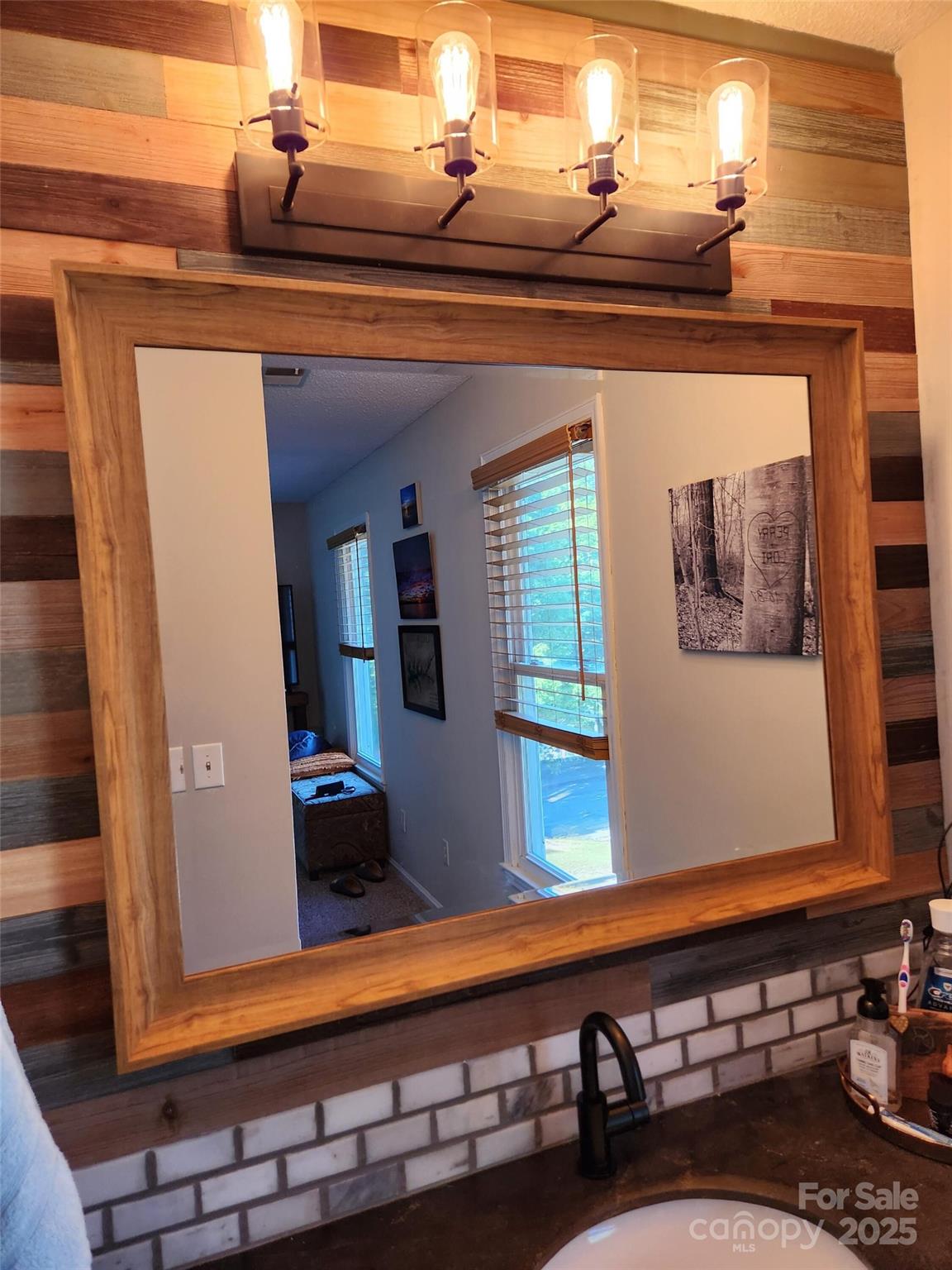 816 Maize Street Lexington, SC 29072 - Photo 24 of 34 a close view of a sink a mirror and dresser