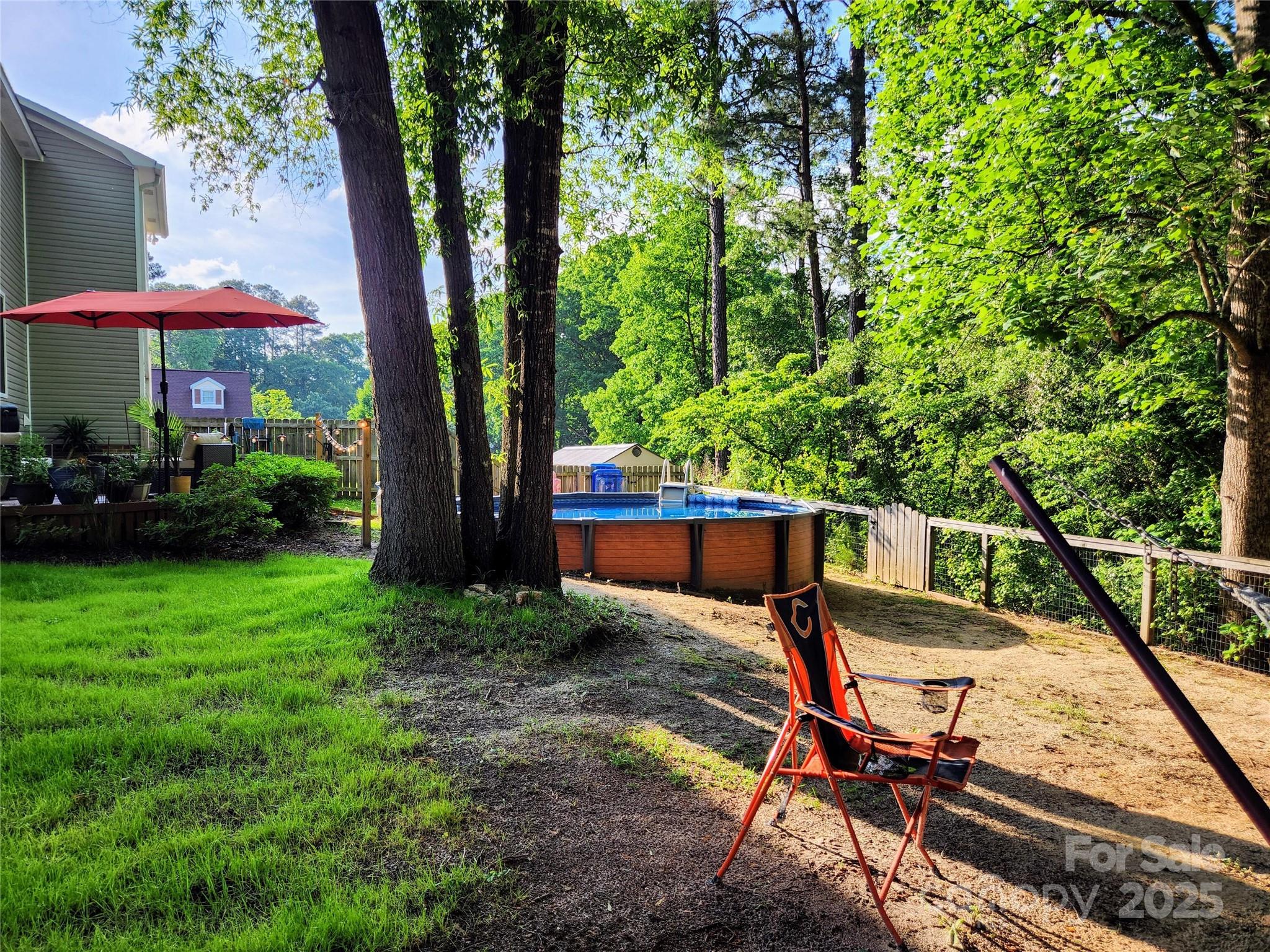 816 Maize Street Lexington, SC 29072 - Photo 27 of 34 a view of a backyard with furniture and a garden