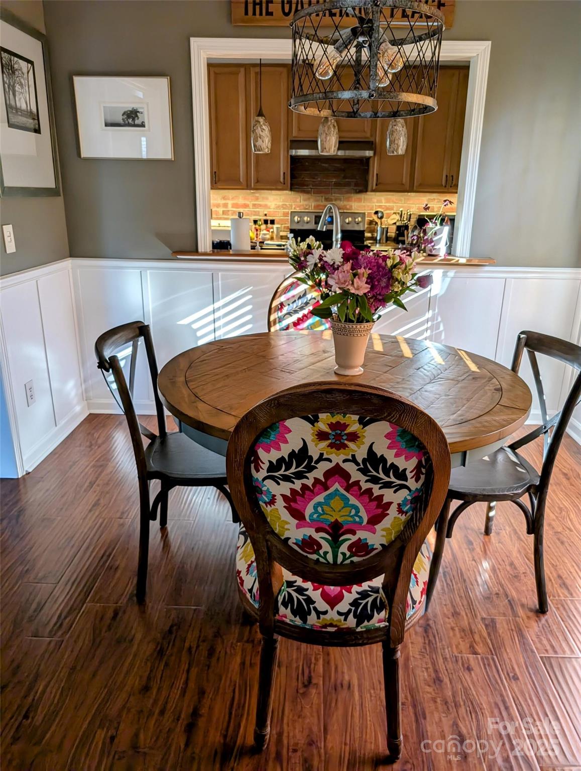 816 Maize Street Lexington, SC 29072 - Photo 8 of 34 a view of a dining room with furniture and wooden floor