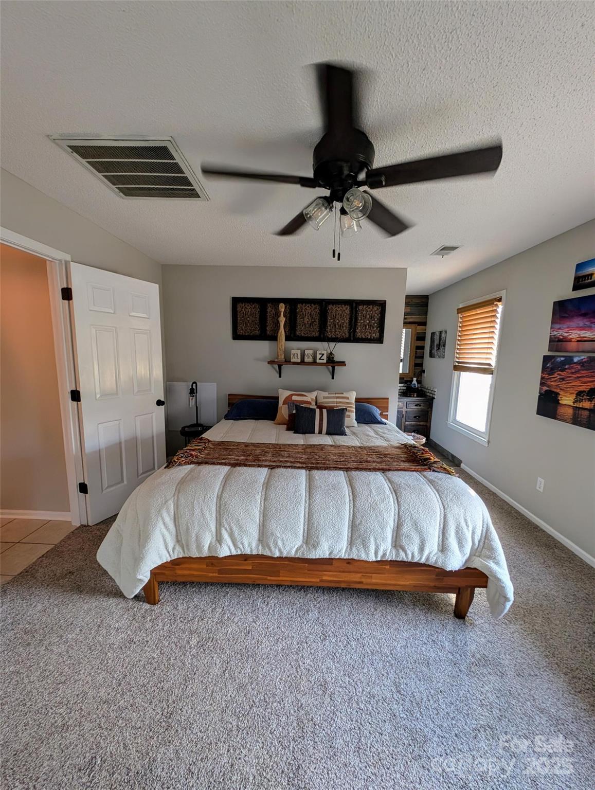 816 Maize Street Lexington, SC 29072 - Photo 10 of 34 a bed sitting in a bedroom next to a window