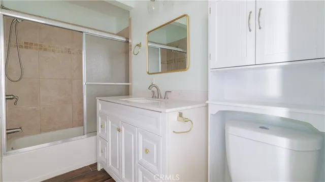 a bathroom with a sink a mirror and a bathtub