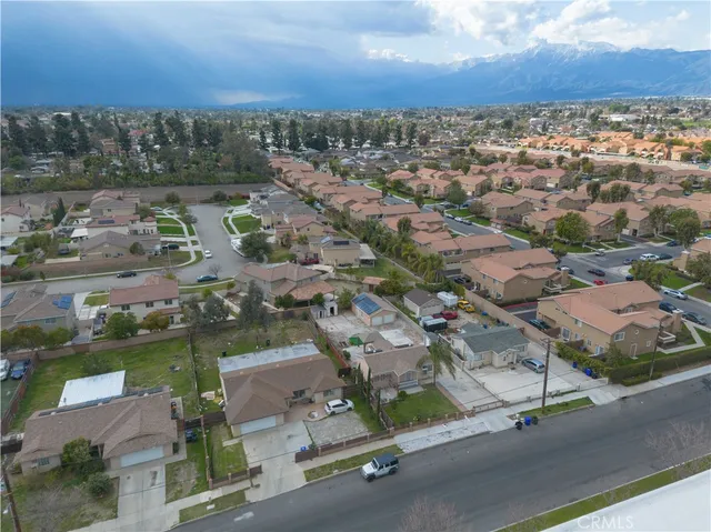 an aerial view of residential houses with outdoor space