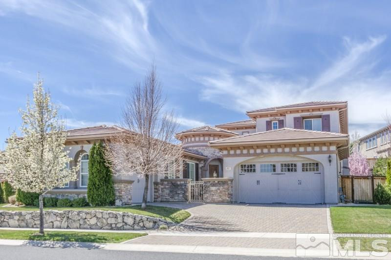 1831 Laurel Ridge Drive Reno, NV 89523 - Photo 1 of 1 a front view of a house with a garden