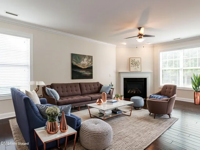a living room with furniture and a fireplace