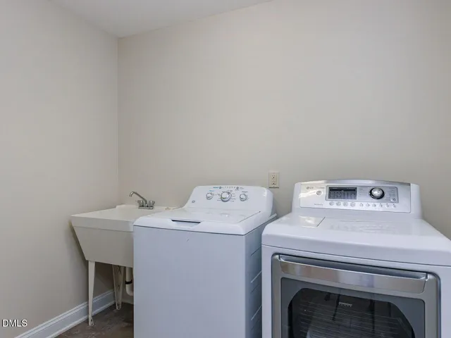 a bathroom with a granite countertop sink a toilet and a mirror