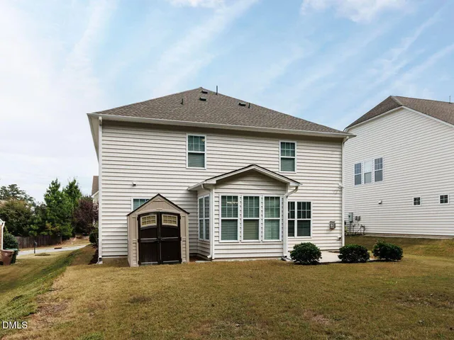 a balcony with wooden floor and lake view