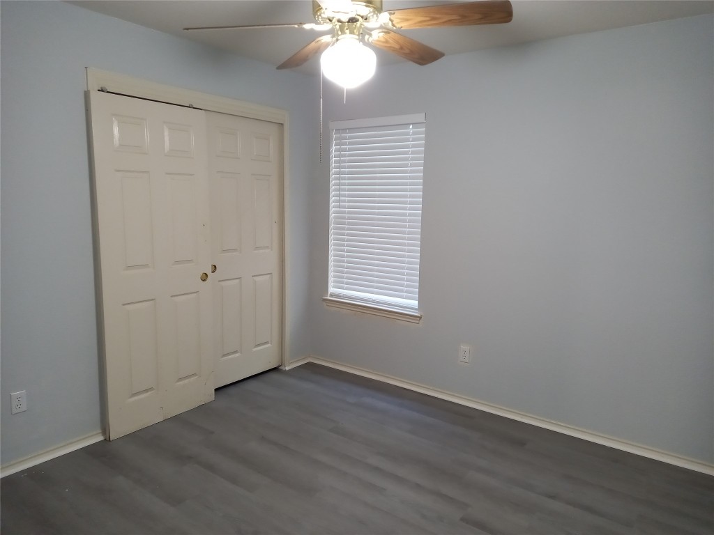 2018 Old Mill Road Cedar Park, TX 78613 - Photo 13 of 22 wooden floor in an empty room with a window