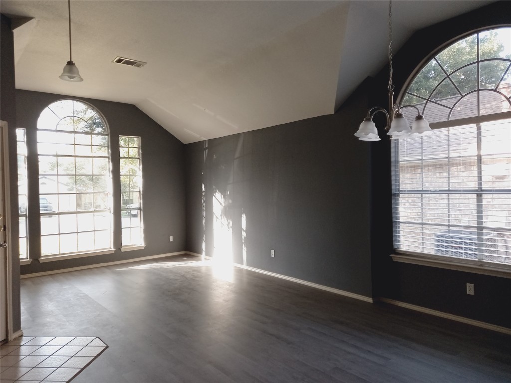 2018 Old Mill Road Cedar Park, TX 78613 - Photo 14 of 22 an empty room with wooden floor and windows