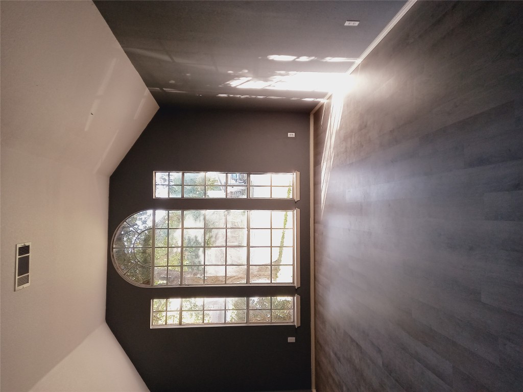 2018 Old Mill Road Cedar Park, TX 78613 - Photo 15 of 22 an empty room with wooden floor and windows