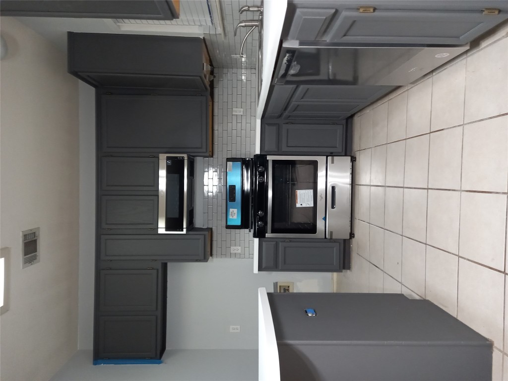 2018 Old Mill Road Cedar Park, TX 78613 - Photo 20 of 22 a kitchen with a sink and a stove