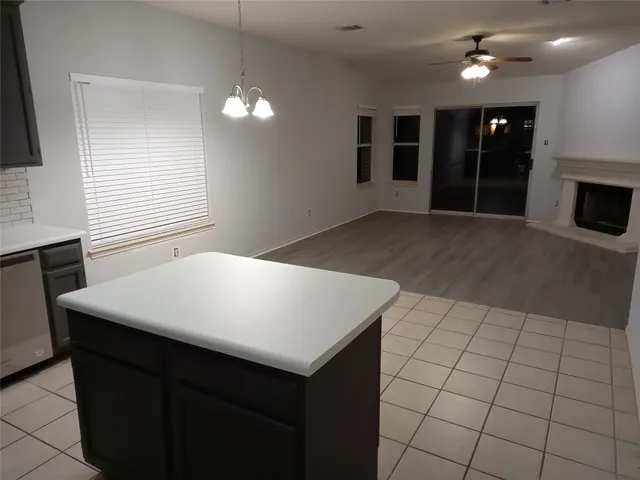 a bathroom with a glass door shower a sink and vanity