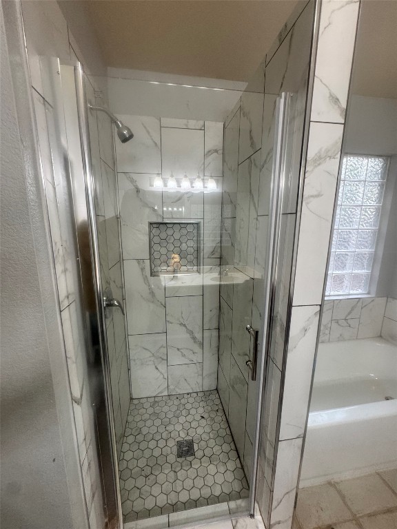 2018 Old Mill Road Cedar Park, TX 78613 - Photo 6 of 22 a bathroom with a glass door shower a sink and vanity